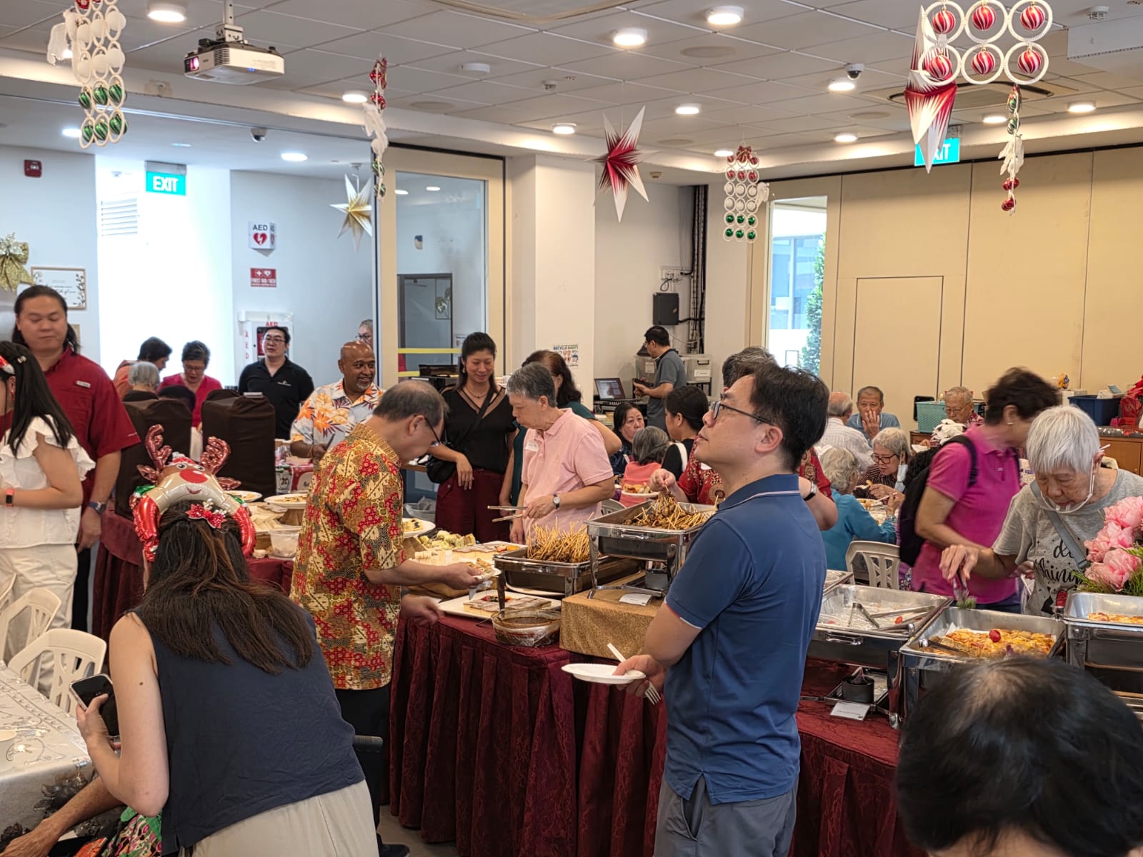 3 Guests enjoy a sumptious high tea buffet.jpg